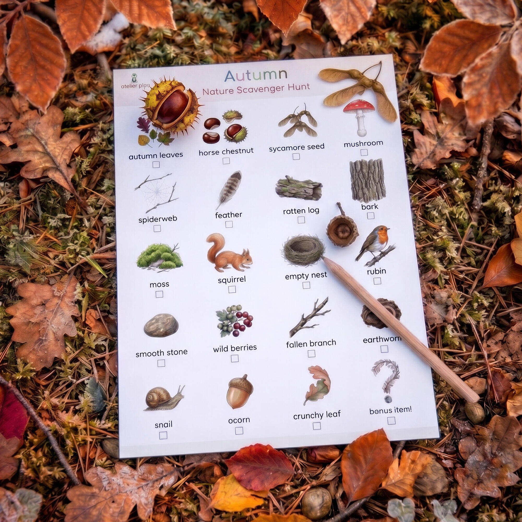 Printable autumn nature scavenger hunt with a pencil, lying on fallen leaves and moss